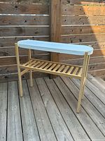 Full view of IKEA Satsumas plant stand showing bamboo frame and white oval tray