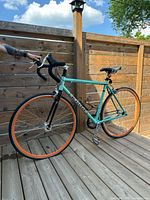 Full left side view of Kona Paddy Wagon bicycle on deck