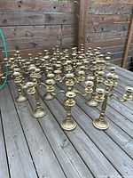 All 15 gold candelabras arranged on deck