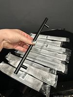 Nine pulls laid out with protective sleeves