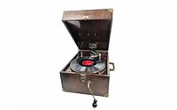 Suitcase-style phonograph open showing record on turntable