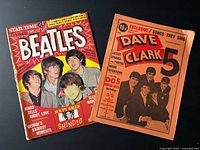 Front covers of both magazines visible