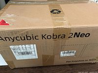 Sealed outer carton showing Anycubic Kobra 2 Neo branding