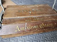 Close-up of lid showing Bissell branding, Cyco Ball-Bearing, American Queen lettering