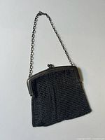 Full view of purse with chain handle displayed