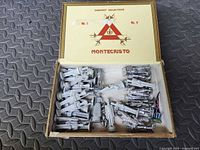 Open Montecristo box showing pile of unpainted lead soldiers