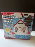 Front of boxed Snoopy Sno-Cone Machine