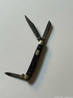 Knife open showing three blades