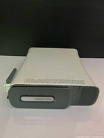 Front and top view of Xbox 360 Pro console showing 120GB hard drive slot