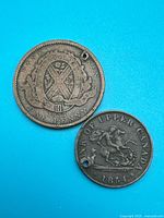 Front view of both 1837 and 1854 tokens
