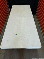 Top view of full folding table showing overall size and surface condition