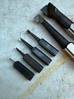 All six boring bars laid out showing relative sizes and tips