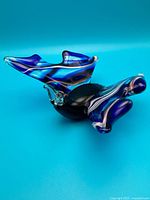 Full view of blue and white Murano glass sculpture on side