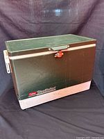 Full view of cooler front showing latch and logo