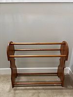 Full view of wooden rack front showing three bars and overall design