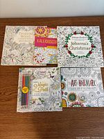 All five colouring books front covers displayed