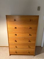 Front view showing entire 6-drawer dresser