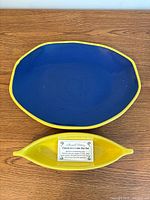 Top view of blue platter with yellow rim and yellow dip bowl