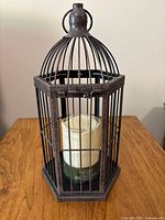 Front view of metal lantern with LED candle inside
