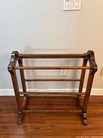 full view of wooden quilt rack front angle