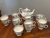 Royal Albert Silver Birch teapot with lid and teacups on wooden table