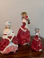 Front view of all three Royal Doulton figurines