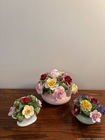 All three floral arrangements on table