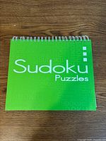Front cover of green Sudoku puzzle book