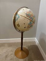 Full view of globe on stand
