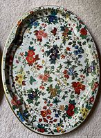 Front of tray showing full floral design and blackened wear spot