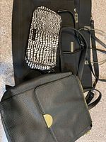 Group shot showing Donna Karan briefcase, Kenneth Cole backpack, Vera Bradley handbag