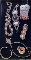 Overall view showing all jewelry pieces in lot