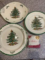 All three Spode Christmas Tree plates and boxed Pimpernel coasters