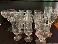 Group view of all 15 etched Princess House glasses