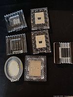 Six of the seven lead crystal frames shown: ribbed square, diamond-cut square, ribbed rectangle, diamond-cut square, ribbed oval, ribbed landscape rectangle