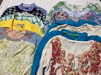 Full assortment of women’s tops laid out