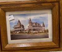 Full view of framed print showing entire artwork and wood frame