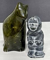 Front view of both sculptures showing overall shapes, colors, and relative sizes