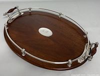 Full view of oval Edwardian cocktail tray with oak base and silver-plated railing and handles