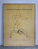 Front view of framed poster hanging on wall showing full wire-sculpture illustration and text.
