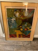 Front view of the abstract framed print showing the artwork, metal frame, and yellow matting.