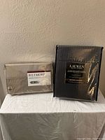 Both packaged bed linen sets: Biltmore 100% cotton sheet set and Lauren Ralph Lauren bed blanket