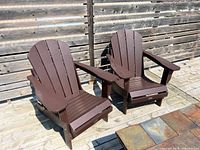 Two chairs fully assembled, front view on wood deck