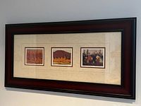 Framed set of three limited edition Tom Thomson prints hung on a wall, showing all prints and frame.
