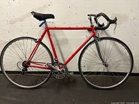 Full side view of red Gardin road bicycle
