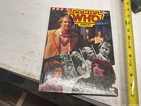 Front cover of the Doctor Who Annual book showing the Fifth Doctor and other characters in a collage style with title logo.