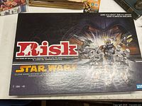 Closed box of Star Wars Risk Clone Wars Edition showing cover artwork and branding.