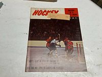 Magazine cover showing hockey players in action during a game, title 'Hockey Pictorial' and headline 'Anatomy of a Bloody Brawl'