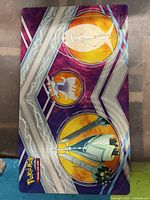 Full view of the Pokemon Trading Card Game playmat showing the Legendary Pokemon artwork and the Pokemon TCG logo.
