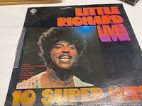 Front cover of Little Richard Live vinyl record showing the artist's close-up photo and album title with some light scratches on the cover.